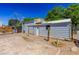 Side of a building with metal siding and roof with a small deck at 208 W Alma St, Overton, NV 89040