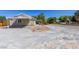 Charming single-story home with a spacious front yard and covered carport area, perfect for outdoor activities at 208 W Alma St, Overton, NV 89040