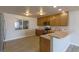 Inviting kitchen with stainless steel appliances, wooden cabinets, and a convenient breakfast bar for casual dining at 208 W Alma St, Overton, NV 89040