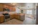 Well-lit kitchen featuring stainless steel appliances, ample cabinet space, and a convenient breakfast bar at 208 W Alma St, Overton, NV 89040