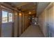 Unfinished room with framing, concrete floor, and window, offering potential for customization at 208 W Alma St, Overton, NV 89040