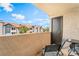 Balcony with seating and table overlooking the community at 2451 N Rainbow Blvd # 2131, Las Vegas, NV 89108