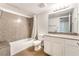 Bright bathroom features granite counters and tub with shower at 2451 N Rainbow Blvd # 2131, Las Vegas, NV 89108