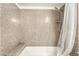Bright bathroom features a tub with seat and shower at 2451 N Rainbow Blvd # 2131, Las Vegas, NV 89108