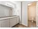 Well-lit bathroom with a granite countertop vanity and a separate toilet and shower room at 2451 N Rainbow Blvd # 2131, Las Vegas, NV 89108