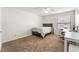 Comfortable bedroom with neutral tones, a ceiling fan, and a dedicated workspace at 2451 N Rainbow Blvd # 2131, Las Vegas, NV 89108