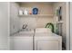 Laundry room with washer, dryer, and storage shelf at 2451 N Rainbow Blvd # 2131, Las Vegas, NV 89108