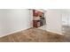 View from a secondary living area toward the kitchen, and a connecting living room with carpeted floors at 2451 N Rainbow Blvd # 2131, Las Vegas, NV 89108