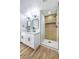 Modern bathroom featuring a double vanity, sleek fixtures, and a glass-enclosed shower with a built-in niche at 2529 Indian Sage Way, Las Vegas, NV 89108