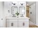 Stylish bathroom with double sinks, quartz countertop, black hardware, and walk-in shower at 2529 Indian Sage Way, Las Vegas, NV 89108