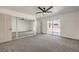 Bright bedroom featuring carpet, mirrored closet doors, and a sliding glass door for backyard access at 2529 Indian Sage Way, Las Vegas, NV 89108