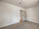 A small carpeted bedroom provides a calm atmosphere with ample natural light at 2529 Indian Sage Way, Las Vegas, NV 89108