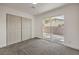 Spacious bedroom with bi-fold closet doors and backyard access at 2529 Indian Sage Way, Las Vegas, NV 89108