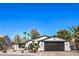 Charming single-story home features desert landscaping, a black garage door, and a well-maintained front yard at 2529 Indian Sage Way, Las Vegas, NV 89108