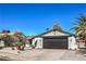 Charming single-story home features desert landscaping, a black garage door, and a well-maintained front yard at 2529 Indian Sage Way, Las Vegas, NV 89108