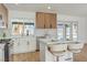 Eat-in kitchen showcases updated cabinets, white counters, stainless steel appliances, and a modern design at 2529 Indian Sage Way, Las Vegas, NV 89108