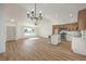 Open floor plan shows the eat-in kitchen, living area with a large window, and entry to the front door at 2529 Indian Sage Way, Las Vegas, NV 89108