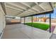 Outdoor patio with large covered seating area, synthetic grass lawn, and desert landscaping at 2529 Indian Sage Way, Las Vegas, NV 89108