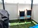 Backyard featuring an artificial turf area with a grill and play easels at 2585 Amazing Meadows Ave # 1007, North Las Vegas, NV 89031