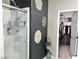 Bathroom with glass shower and decorative wall art near the walk in closet at 2585 Amazing Meadows Ave # 1007, North Las Vegas, NV 89031