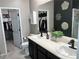 Bathroom with double sinks, granite counters, and a walk-in closet at 2585 Amazing Meadows Ave # 1007, North Las Vegas, NV 89031