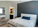 Serene bedroom featuring a large bed, stylish decor, and a glimpse into the closet at 2585 Amazing Meadows Ave # 1007, North Las Vegas, NV 89031