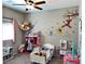 bedroom featuring a window, Winnie the Pooh decals, and space for activities at 2585 Amazing Meadows Ave # 1007, North Las Vegas, NV 89031