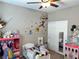bedroom with Winnie the Pooh wall decals and plenty of space for activities at 2585 Amazing Meadows Ave # 1007, North Las Vegas, NV 89031