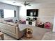 Open-concept living room with carpet, decor, a television, and natural light from the window at 2585 Amazing Meadows Ave # 1007, North Las Vegas, NV 89031