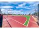 Image features a well-maintained basketball court with vibrant colors and multiple hoops, ready for games at 2601 Bechamel Pl, Henderson, NV 89044
