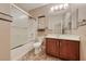 Bright bathroom featuring a shower-tub, vanity with storage, and decorative fixtures at 2601 Bechamel Pl, Henderson, NV 89044