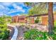 Image shows the Madeira Canyon community entrance, featuring lush greenery and architectural details at 2601 Bechamel Pl, Henderson, NV 89044