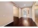 Open-concept foyer with hardwood floors, neutral paint, arched doorways and stylish lighting at 2601 Bechamel Pl, Henderson, NV 89044