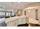 Open kitchen with granite countertop, stainless steel appliances, and view to the living room at 2601 Bechamel Pl, Henderson, NV 89044