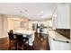 Stylish kitchen featuring modern appliances, granite countertops and a raised breakfast bar at 2601 Bechamel Pl, Henderson, NV 89044