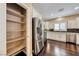 Bright kitchen features stainless steel appliances, dark wood flooring and white cabinetry at 2601 Bechamel Pl, Henderson, NV 89044