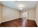 Neutral living room featuring dark hardwood floors, neutral colored walls and recessed lighting at 2601 Bechamel Pl, Henderson, NV 89044