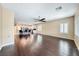 Spacious living room showcasing hardwood floors, plantation shutters, and an open-concept design at 2601 Bechamel Pl, Henderson, NV 89044