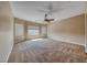 Expansive main bedroom has neutral carpeting, ceiling fan, and natural light at 2601 Bechamel Pl, Henderson, NV 89044