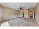 Spacious main bedroom features ceiling fan, and a view of the ensuite bathroom at 2601 Bechamel Pl, Henderson, NV 89044