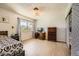 Well-lit bedroom with wood floors, a comfortable bed, a large window and closet with sliding doors at 2748 Heritage Cir, Las Vegas, NV 89121