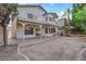 Backyard with spacious patio, balcony, palm trees, and room for entertaining at 2808 Deep Water Cir, Las Vegas, NV 89117