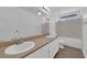 Modern bathroom with double sinks, granite countertops, and a combination tub and shower with great lighting at 2808 Deep Water Cir, Las Vegas, NV 89117