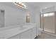 Bathroom with a large mirror, vanity sink, and tiled shower at 2808 Deep Water Cir, Las Vegas, NV 89117