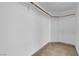 Walk-in closet with ample shelving and rod space for organized storage, enhancing functionality at 2808 Deep Water Cir, Las Vegas, NV 89117