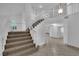Entryway with carpeted stairs, white railings, and high ceilings at 2808 Deep Water Cir, Las Vegas, NV 89117