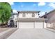 View of the home's facade, showcasing its grand entrance and a three-car garage for ample parking at 2808 Deep Water Cir, Las Vegas, NV 89117