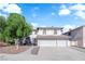 Charming two-story home with a three-car garage, arched windows, and a well-manicured front yard at 2808 Deep Water Cir, Las Vegas, NV 89117
