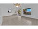 Open living area with tiled floors and access to the kitchen, dining area, and backyard through sliding glass doors at 2808 Deep Water Cir, Las Vegas, NV 89117