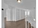 Hallway off the loft with a built in bookcase and three bedrooms at 2808 Deep Water Cir, Las Vegas, NV 89117